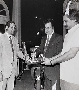 Dilip Kumar delivering first Kinetic scooter